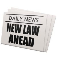 newspaper that reads new law ahead.jpg.crdownload